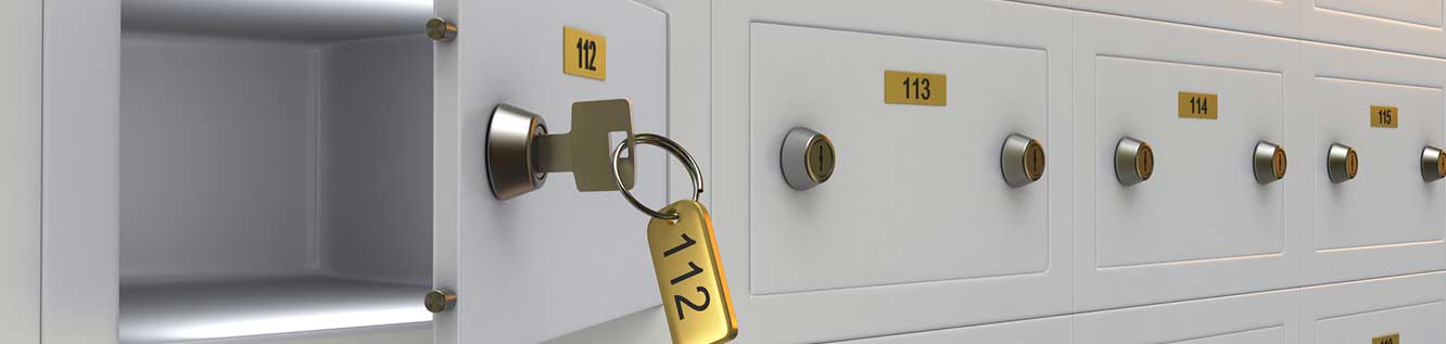 Open safe deposit box with key in it.