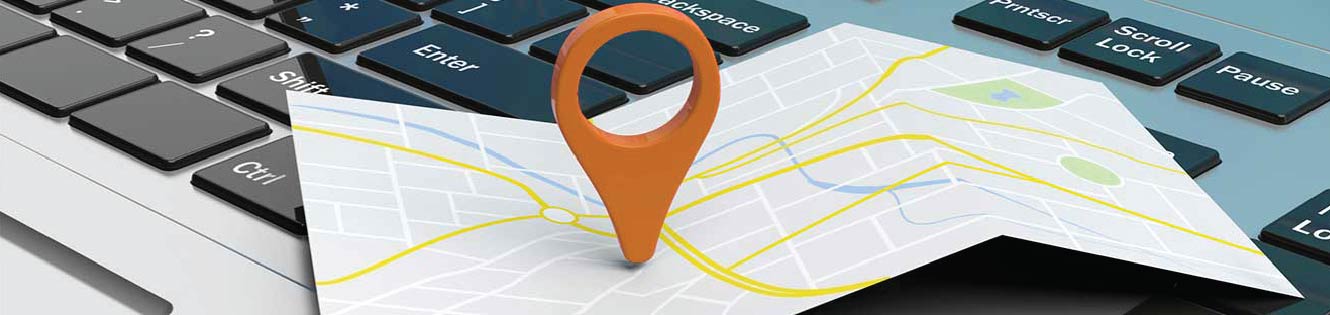 Location pin on a map that is on a laptop.