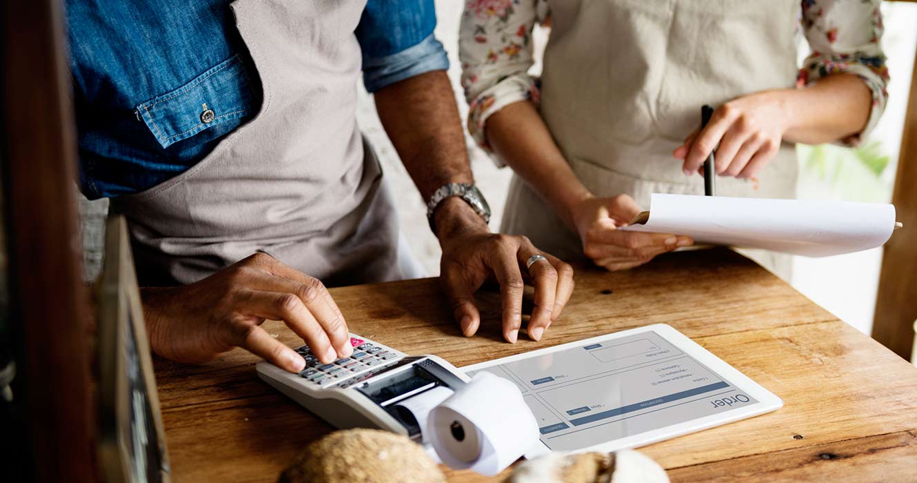 Two business partners looking at financials.